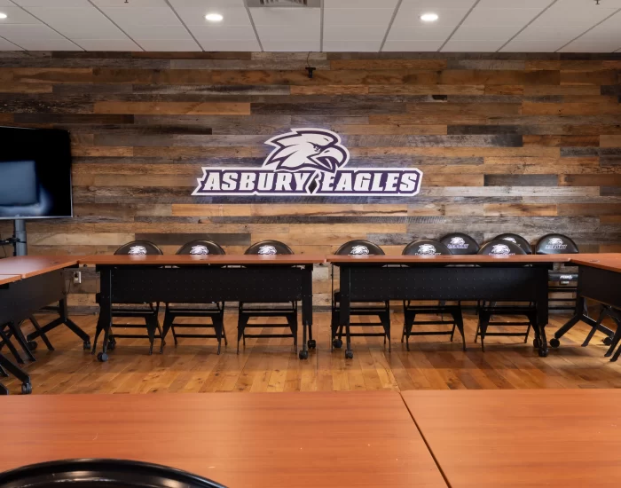Meeting room in Asbury University with a Asbury Eagles logo on the wall