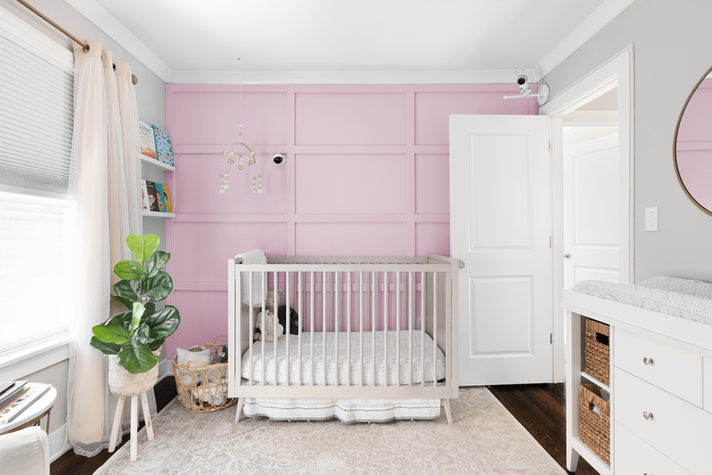 Pink Board and Batten accent wall of a baby bedroom