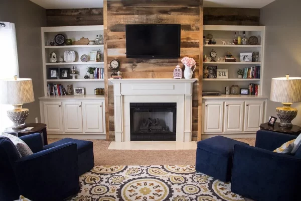 A living room with a fireplace and tv