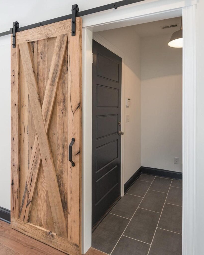 an opened x-pattern reclaimed wood barn door