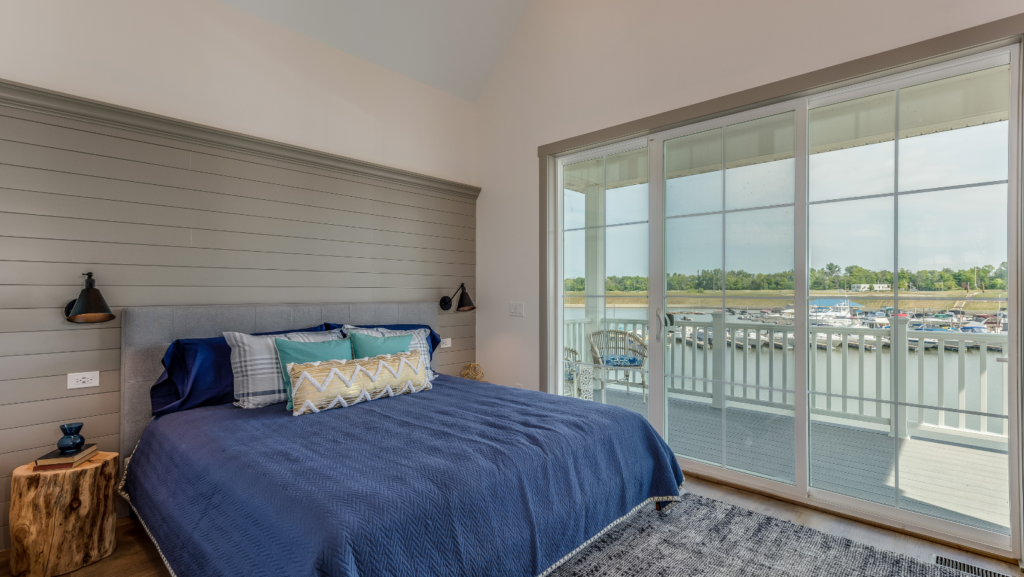a bedroom featuring shiplap accent wall covering