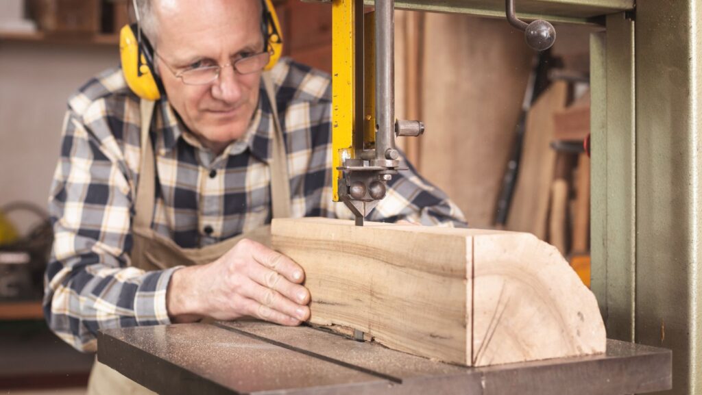 an old man working with wood