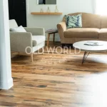 Open living room with Industrial Oak flooring, neutral furniture, and natural light highlighting the reclaimed wood’s patina.
