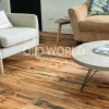 Industrial Oak engineered wood flooring in a modern living room with neutral decor and reclaimed textures visible on each plank.