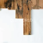 Top-down view of reclaimed Industrial Oak flooring planks showing distressed grain, dark streaks, and saw marks.