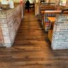 Close up view of the dark rustic barnwood engineered flooring