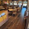 side view of the dark rustic barnwood installed in a restaurant