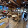 Dark rustic barnwood flooring installed in a restaurant