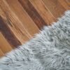 A carpet and fence oak floor, side by side camera shot