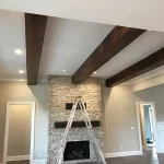 installation in a living room of three custom box beams