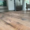 Low angle view of Heartland Barnwood Mixed Oak engineered reclaimed wood flooring highlighting natural saw marks and character in a kitchen setting.