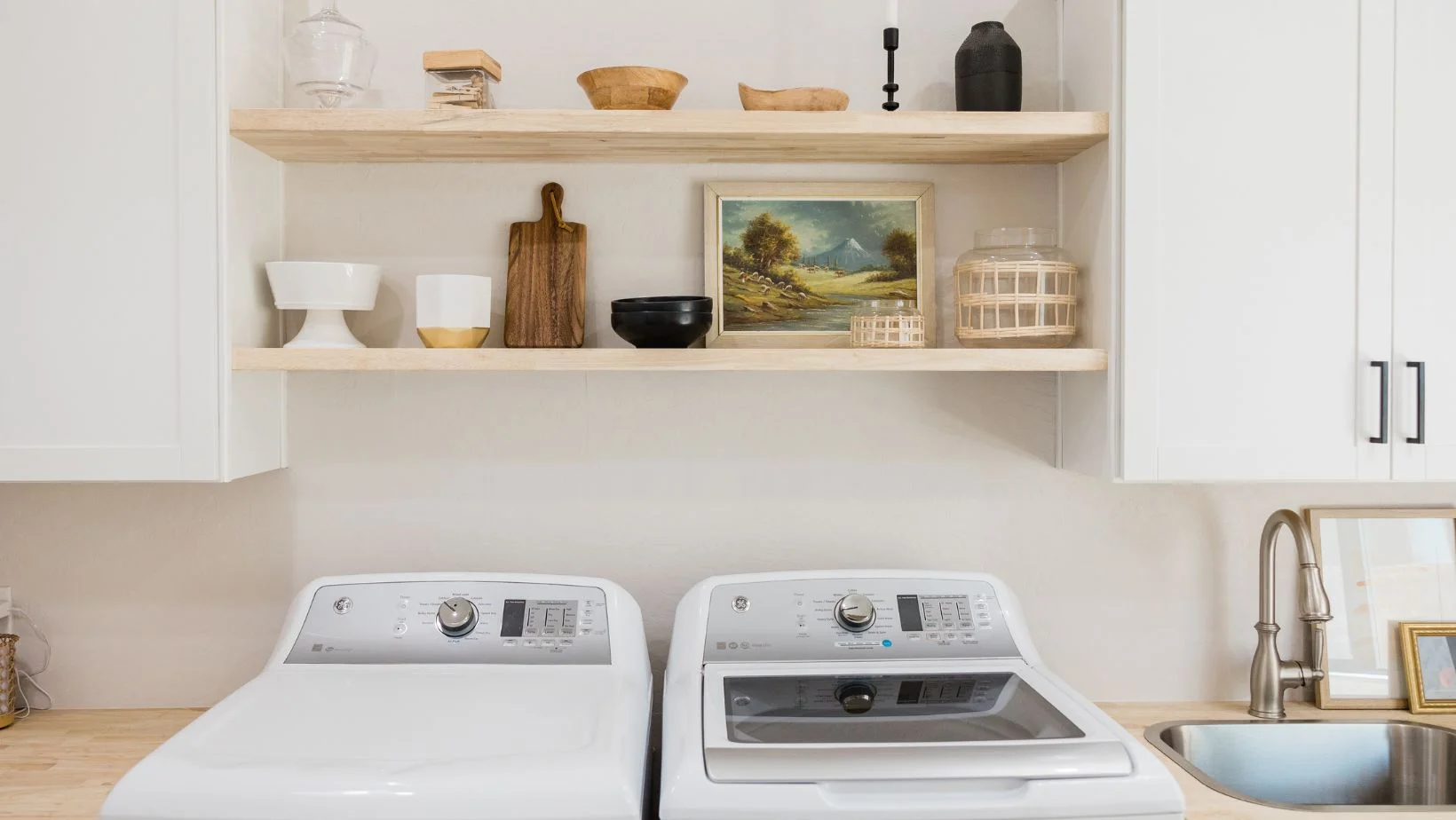 wooden floating shelves in laundry room