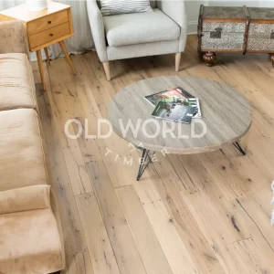 Detailed view of reclaimed white oak flooring planks featuring a clean face, sourced from antique industrial factories.