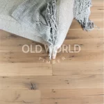 Natural reclaimed white oak engineered flooring showing clean face surface with subtle marks of age and use.