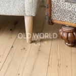 Reclaimed engineered oak flooring planks from old tire and textile factories, clean face and smooth finish.