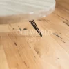 Close-up of Modern Harvest Engineered Oak Flooring showcasing natural grain and character beneath a round modern coffee table.
