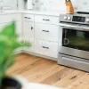 Frigidaire oven and kitchen corner with Modern Harvest engineered flooring showcasing sustainable oak wood with minimal rustic streaks.