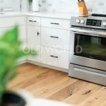 Frigidaire oven and kitchen corner with Modern Harvest engineered flooring showcasing sustainable oak wood with minimal rustic streaks.