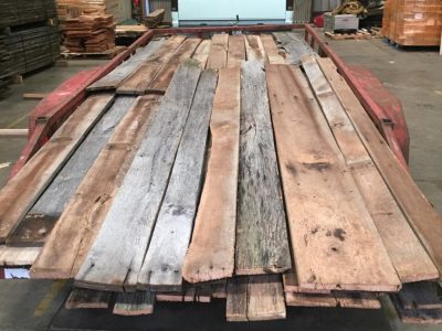 Reclaimed lumber planks that are placed on a transport truck