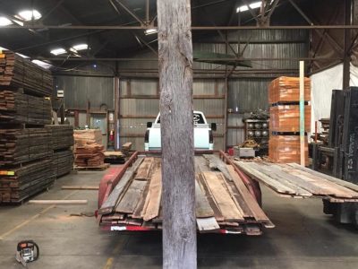 old reclaimed planks being brought in to the warehouse at old world timber in lexington kentucky