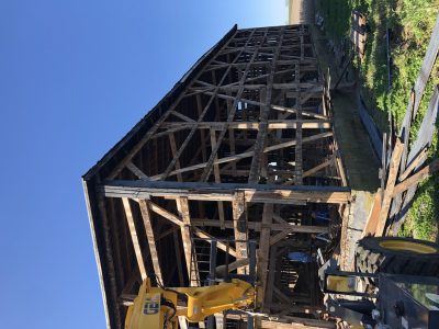 An old wood barn that is being dismantled so the boards can be recycled