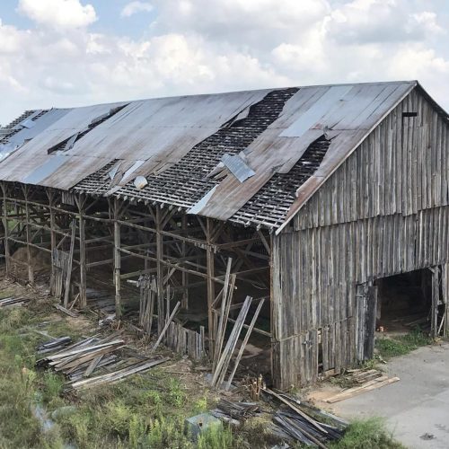 Old gray barn that is being reclaimed