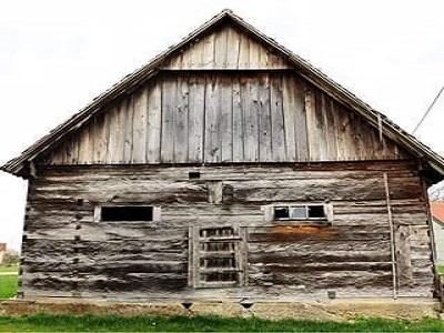 an old antique wood barn from Croatia ready to be recycled, reclaimed and repurposed into interior design products to last for many more years