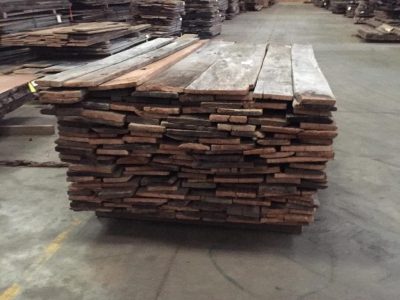old repurposed raw planks being brought in to the warehouse at old world timber in lexington kentucky