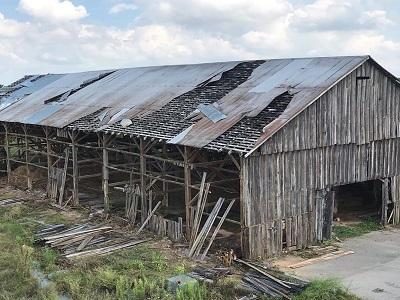 An old antique gray barn ready to be recycled, reclaimed and repurposed into interior design products to last for many more years